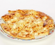 Pita bread with yellow cheese and cheese